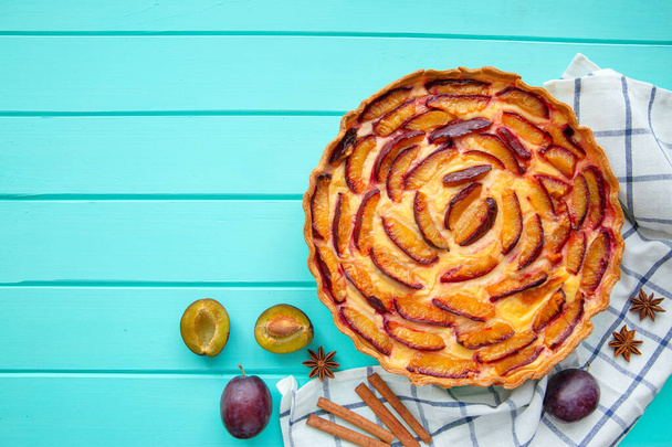 Plum homemade pie with custard cream, copy space, free space for text.  - Фото, изображение
