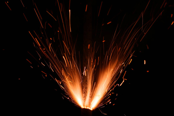 Welding sparks on black background - Photo, Image