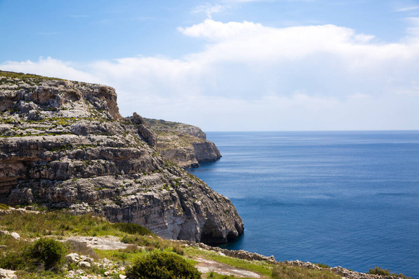 Malta rocky coastline near blue grotto. Bright sunny day, blue waters of Mediterranean sea.  - 写真・画像