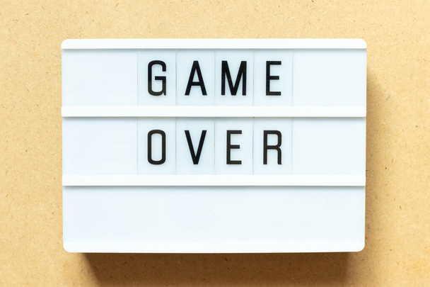 Lightbox with word game over on wood background - Φωτογραφία, εικόνα