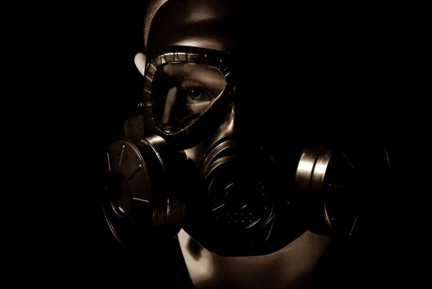 Man is wear gas mask in dark room - Foto, immagini