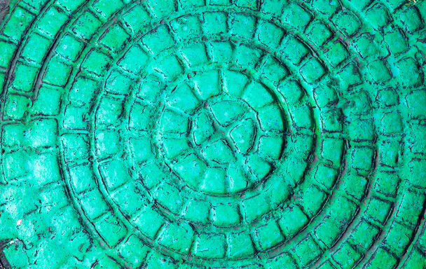 Texture of an old cast-iron sewer manhole. A surface with a beautiful  pattern. Computer desktop wallpaper. - Foto, Bild
