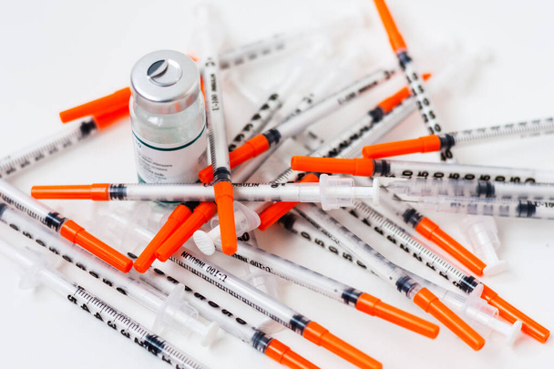 pile of syringes for diabetes on white background, healthcare concept - Photo, image