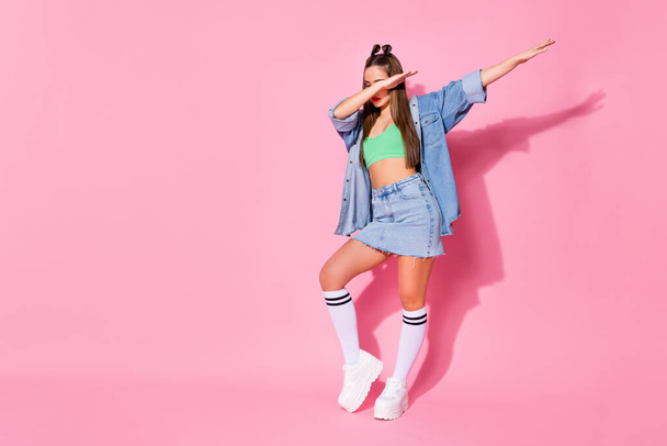 Full length photo of music lover girl enjoy dab dancer perform stage dance wear green denim clothes sneakers isolated over pastel color background - Valokuva, kuva