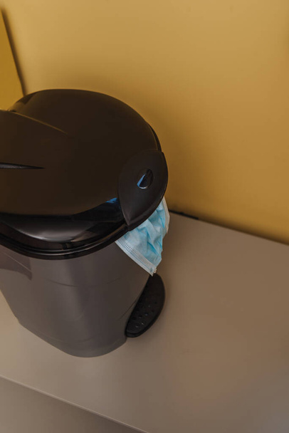 medical mask in trash can, end of quarantine concept  - Photo, Image