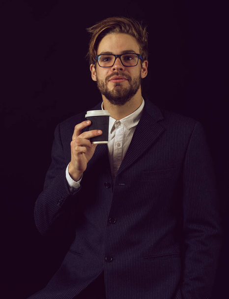 smiling business man in suit on black background - Foto, Imagen