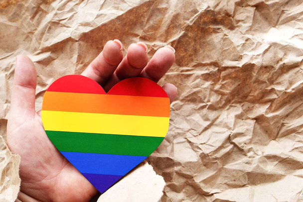 LGBT heart in hand on craft paper - Fotografie, Obrázek