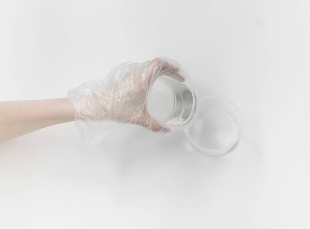 Close up of medical experiments. transparent jar, three pockets with reagents, medical gloves on isolated light background. Experiments for kids. - 写真・画像