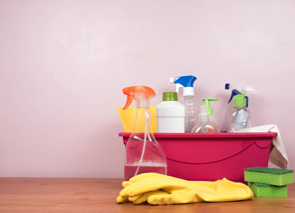 house detergents and cleaning products on a wooden table. concept of disinfection and sanitation in the context of a pandemic and beyond - 写真・画像
