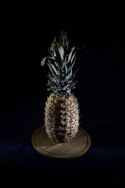 Pineapple fruit on a black background.Silhouette style - Фото, изображение