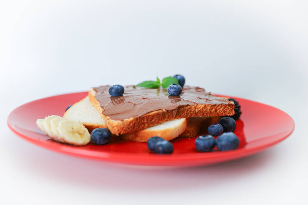 Toast with chocolate and nut paste and berry. - Foto, Imagem