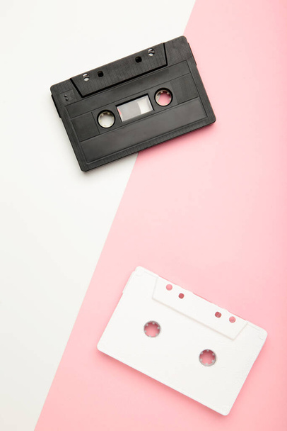 Old cassettes on a colorful background. Music day, top view - 写真・画像