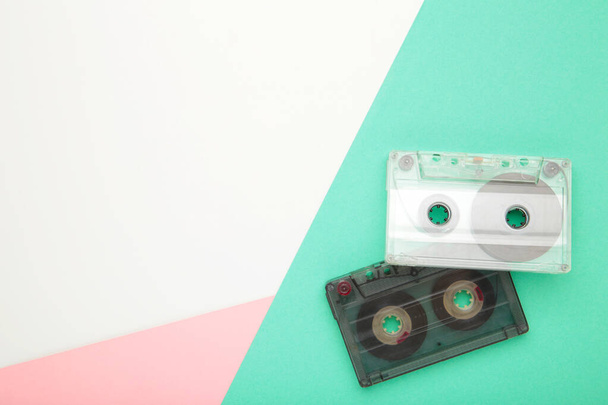 Old cassettes on a colorful background. Music day, top view - Fotoğraf, Görsel