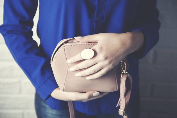 Woman hand  fashion bag and ring - Foto, Imagen