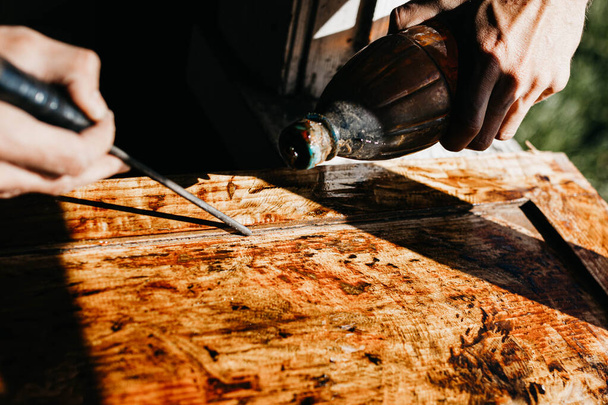 woodwork, processing of solid wood with varnish and epoxy. Handicraft artisan. - Fotó, kép