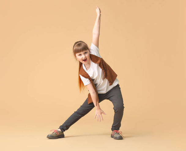 Cute little girl dancing against color background - Photo, Image