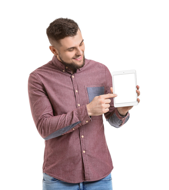 Young man with tablet computer on white background - Zdjęcie, obraz