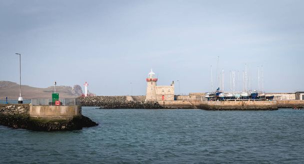 Howth near Dublin, Ireland - February 15, 2019: view of the fishing port of the city where are parked professional fishing boats on a winter day - Photo, Image