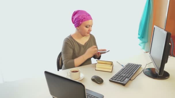 Jewish woman in a headdress in the office works on a computer with information. - 映像、動画