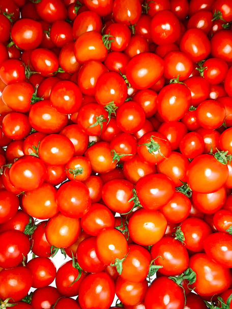 lots of ripe red tomatoes to eat like a background - Photo, Image