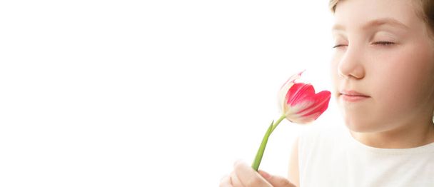Girl with tulip on isolated background - Фото, зображення