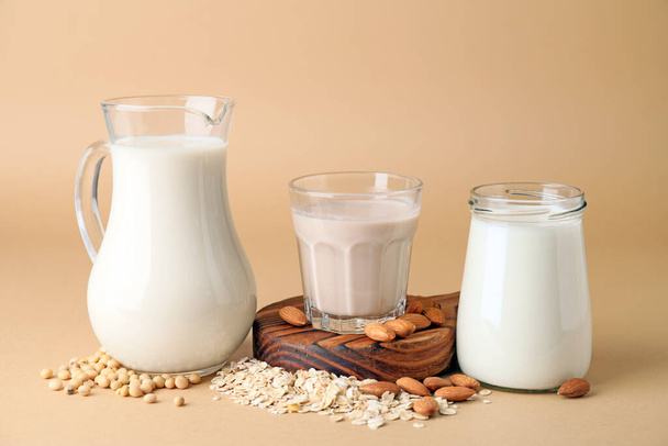 Different milk on color background - Photo, Image
