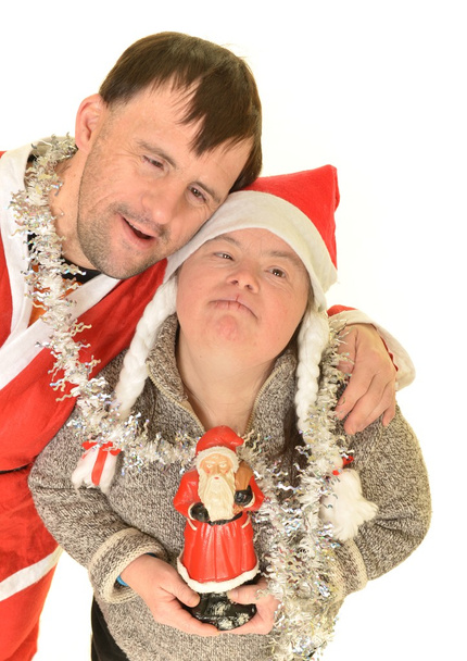 Síndrome de Down pareja en Navidad
 - Foto, imagen