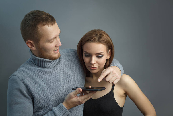 Couple looking at the smartphone - Photo, image