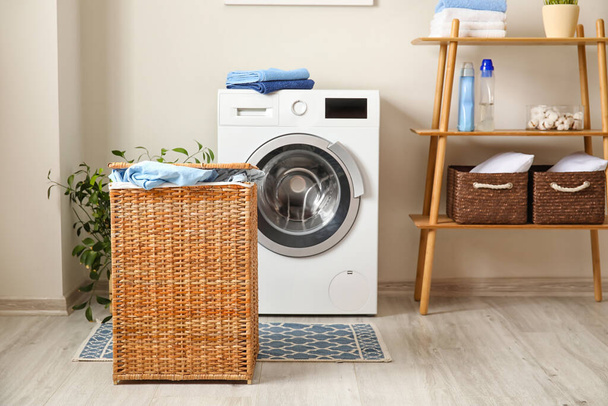Basket with laundry in bathroom - 写真・画像