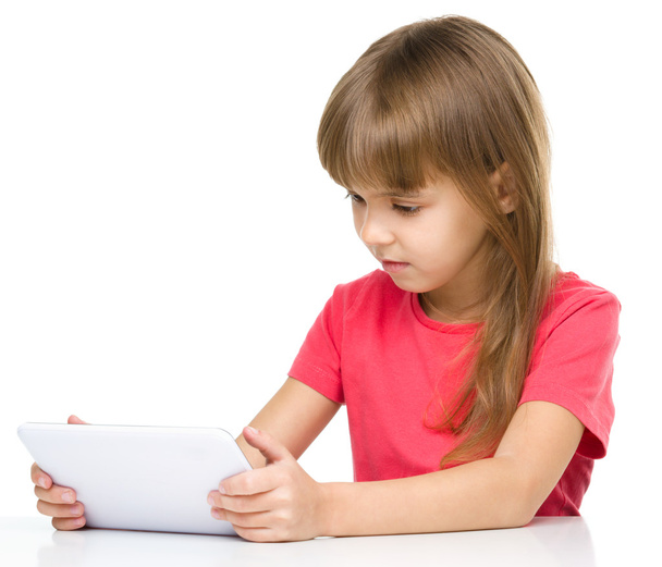 Young girl is using tablet - Photo, image