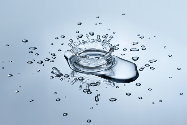 water splash and drops on metallic background - Фото, зображення