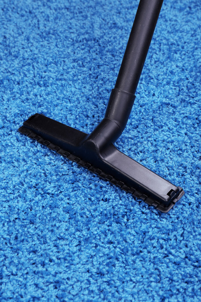 Vacuuming carpet in house - Foto, Bild