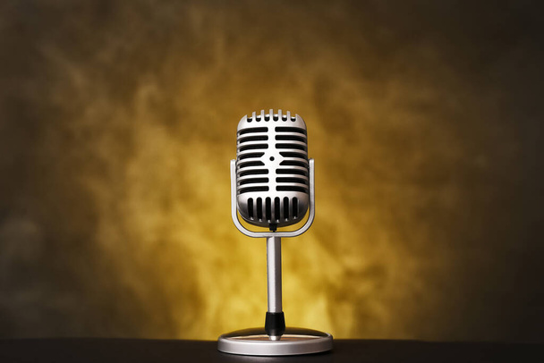Retro microphone on grey background with smoke - Photo, Image