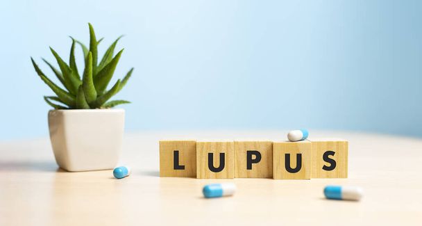 Wooden block form the word LUPUS. Medical concept - Fotoğraf, Görsel