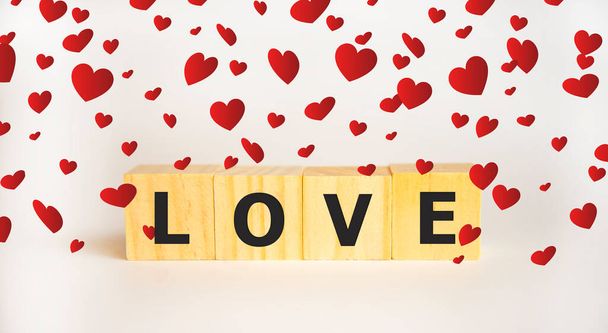 Love message written in wooden blocks. Red heart - Zdjęcie, obraz