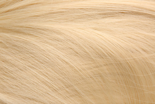 Gezond blond haar als achtergrond - Foto, afbeelding