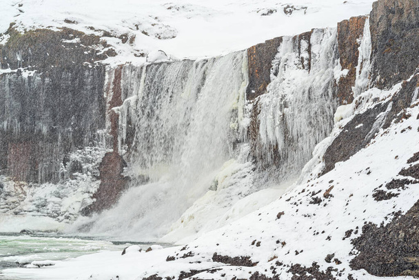 Snaedufoss waterfall during a snowing winter day, Iceland - Fotoğraf, Görsel
