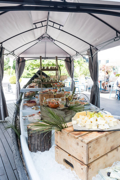 Live food stations. Kitchenware in the line catering summer brunch buffet food luxury hotel outdoor outside garden by the pool al fresco restaurant.Corporate cocktail event party warm food stations. - Φωτογραφία, εικόνα