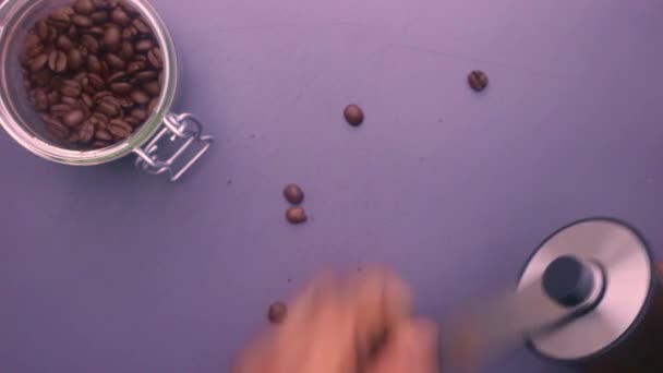 Flat lay person manually grinding roasted coffee beans - Footage, Video