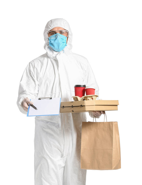 Courier of food delivery service in protective suit on white background. Concept of epidemic - Foto, Imagen