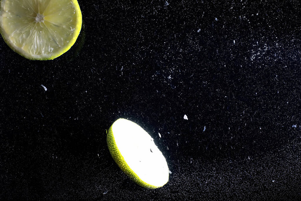Water drops on ripe sweet lemon. Fresh lime  background with copy space for your text. Vegan and vegetarian concept. - Фото, изображение