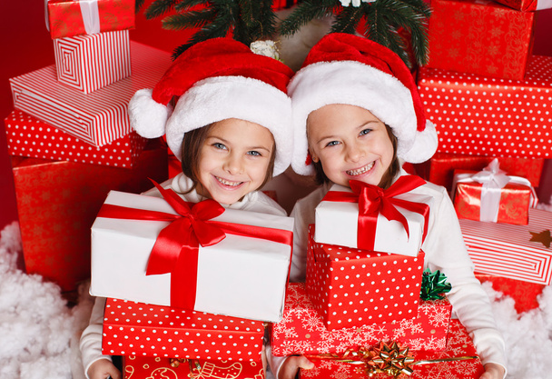 Happy teen sisters decorating Christmas tree - Fotografie, Obrázek