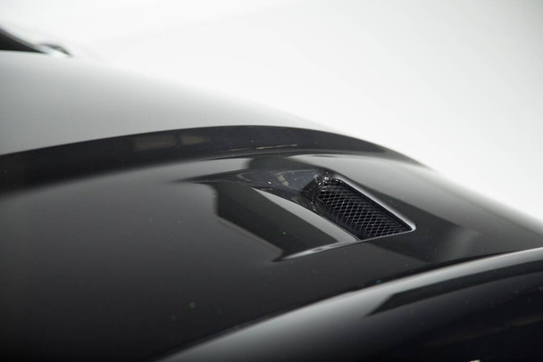 The exterior details of a black modern luxury car - Foto, afbeelding