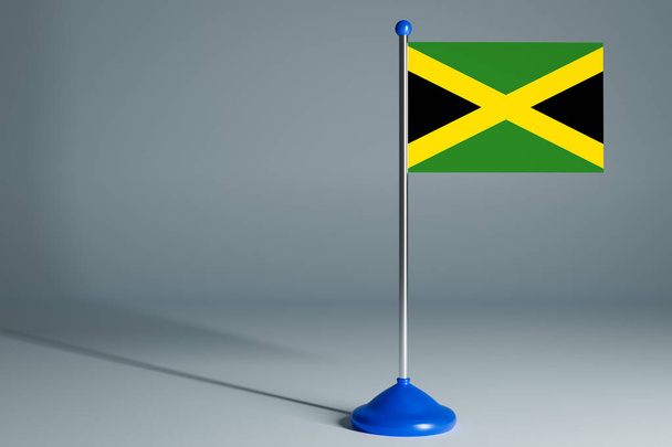 Il 3d rendendo realistica bandiera nazionale della Giamaica su palo in acciaio su sfondo grigio isolato. Bandiera da tavolo bianca, adatta per design, mocku
 - Foto, immagini