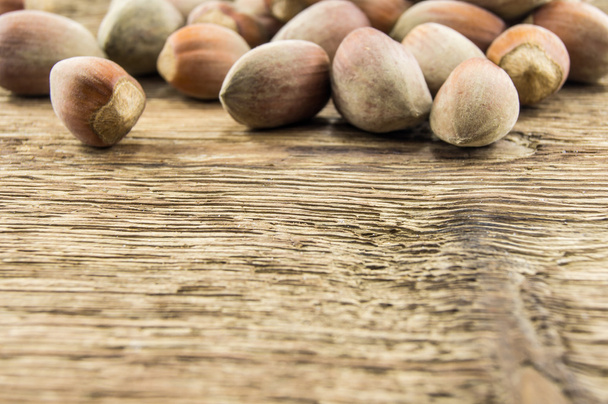 Filberts on a wooden table. Close-up shot. - Photo, Image