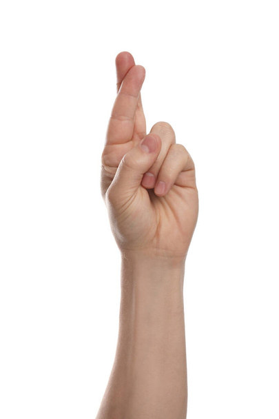 Man with crossed fingers against white background, closeup of hand - Foto, afbeelding
