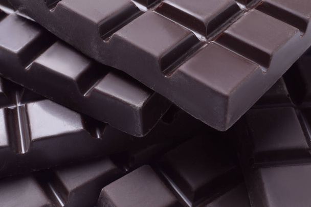Delicious dark chocolate as background, closeup view - 写真・画像