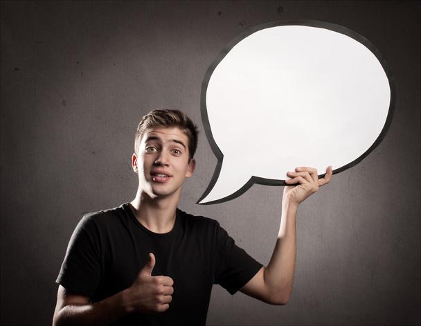 young man holding a speech bubble - 写真・画像
