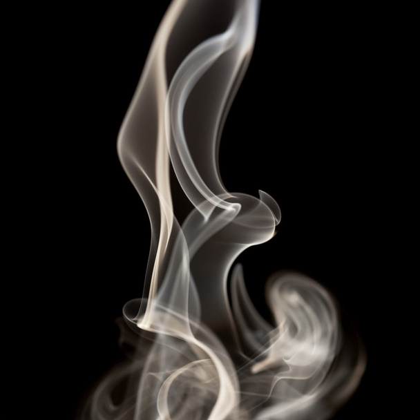 Abstract smoke shapes on black background - Фото, зображення