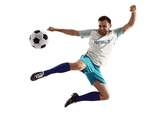 Young man playing football on white background - Photo, image